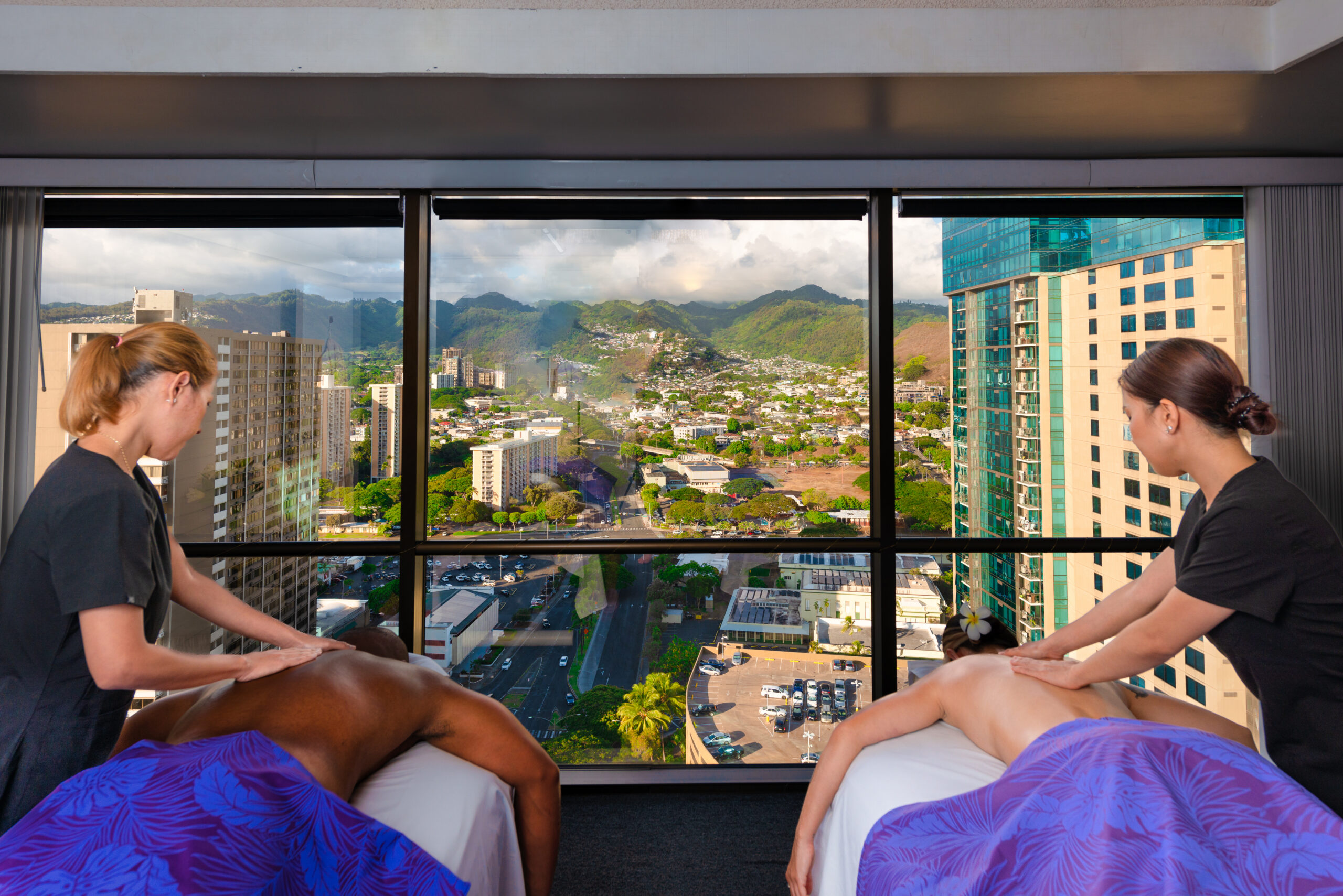Couples massage with Honolulu city view